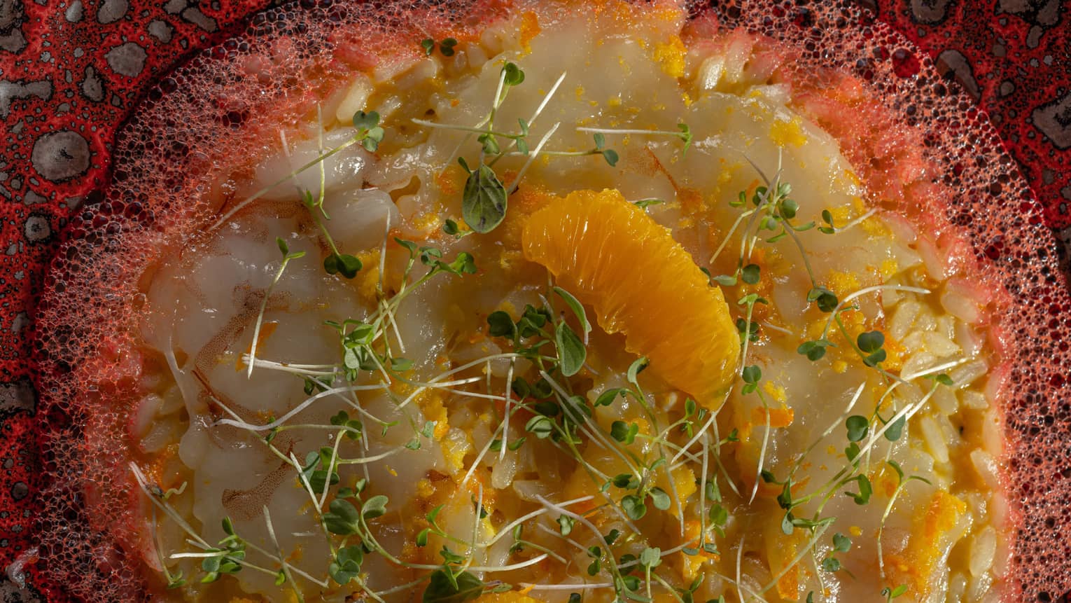 Prawn Ceviche Garnished with Orange Segments and Micro Greens
