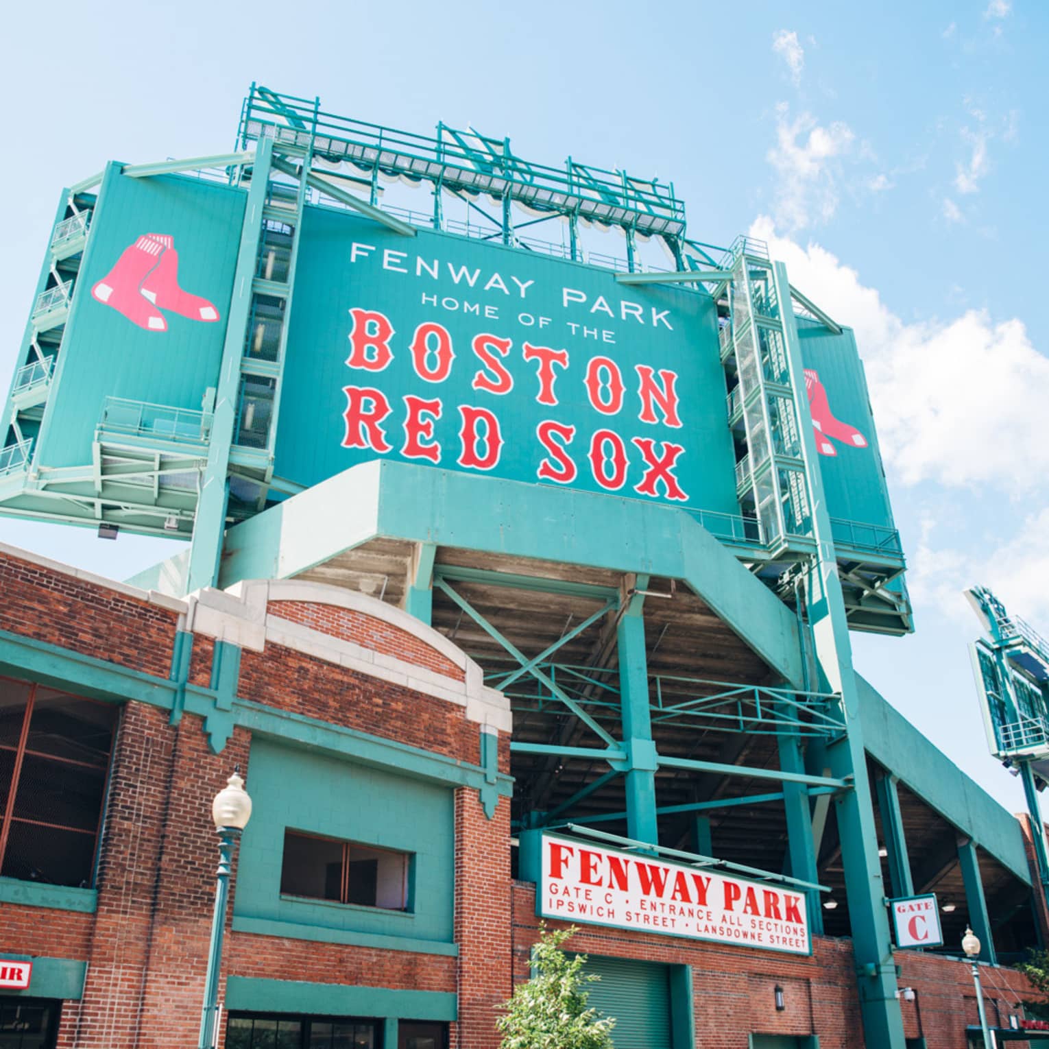 the exterior of fenway park's entrance advertising for the boston red sox