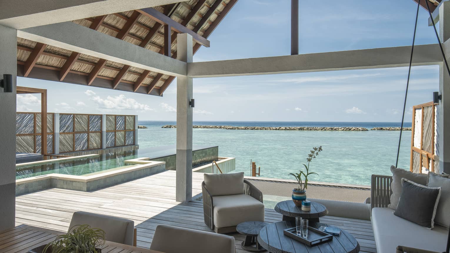 Sunrise Water Villa With Pool outdoor covered patio with swing and chair, ocean views, pool
