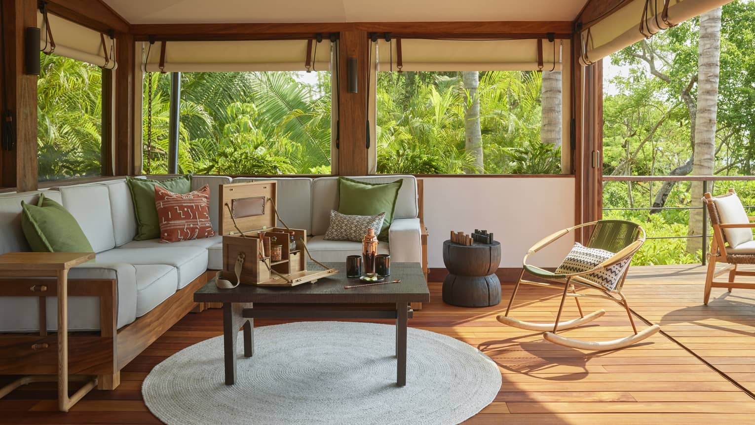 Living room of luxury tent with sofa, coffee table and wooden floors