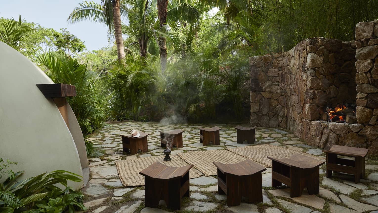 Outside a traditional temazcal or "house of heat," surrounded by lush tropical trees