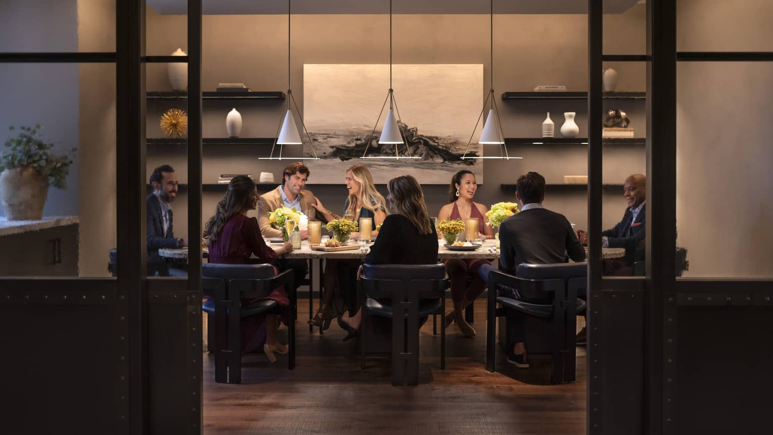 Interior of restaurant with group eating at table