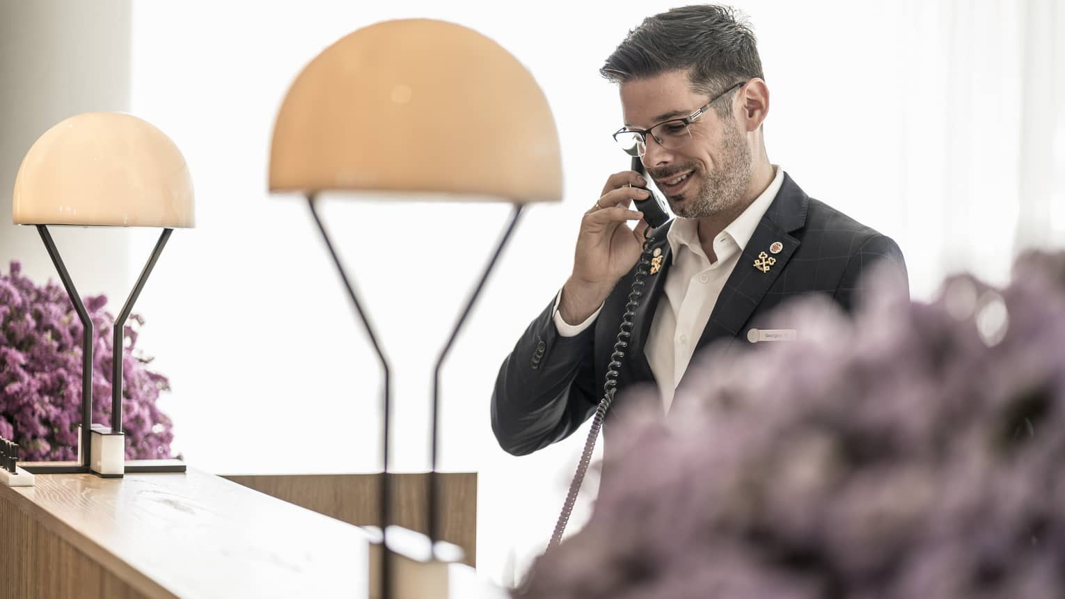 The concierge happily assists guests over the phone 