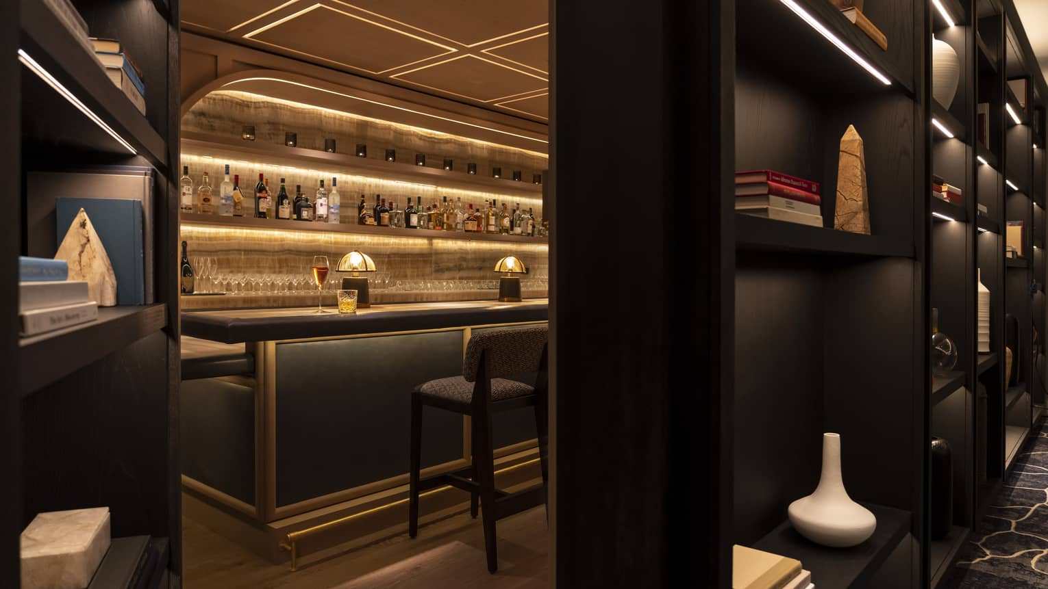 A hidden bar behind a bookshelf.