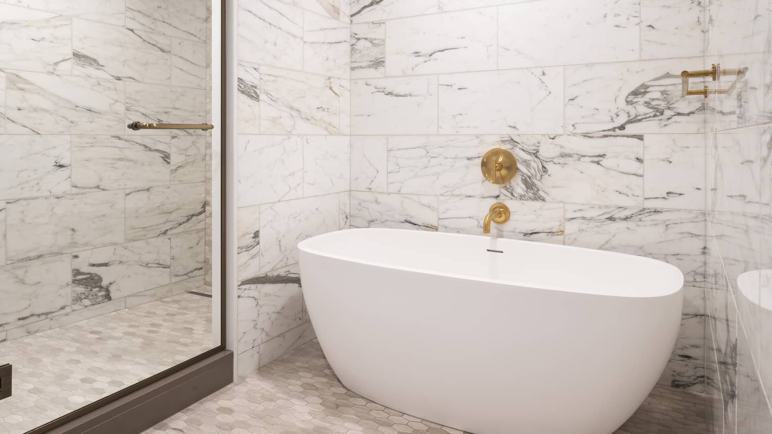 A white bathtub in a white and grey bathroom.