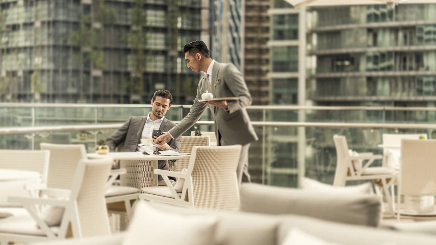 The outdoor terrace of Executive Club at Four Seasons Hotel Kuala Lumpur, with views of KLCC Park