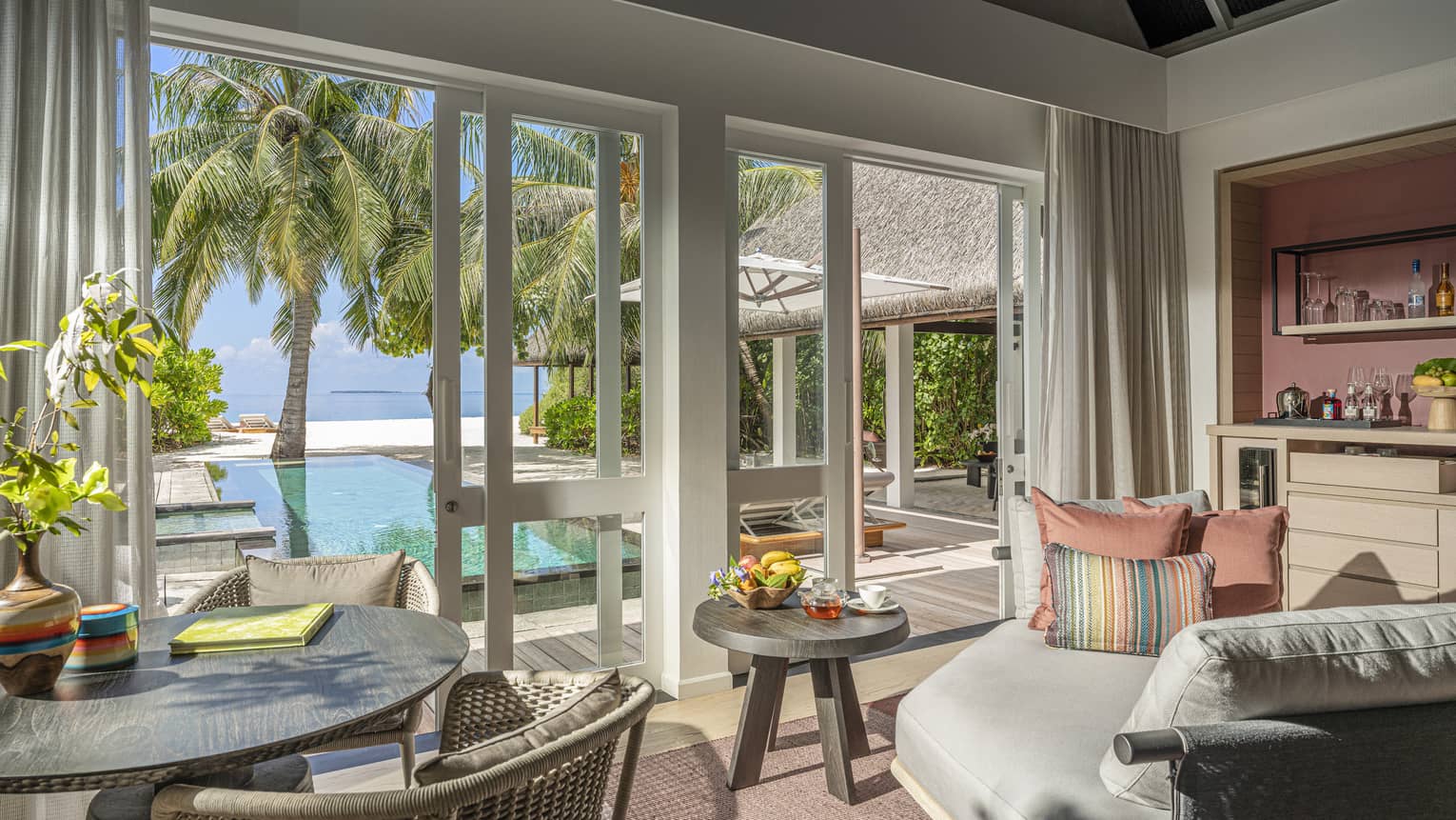 Indoor sitting area and wet bar, leading out to private pool terrace