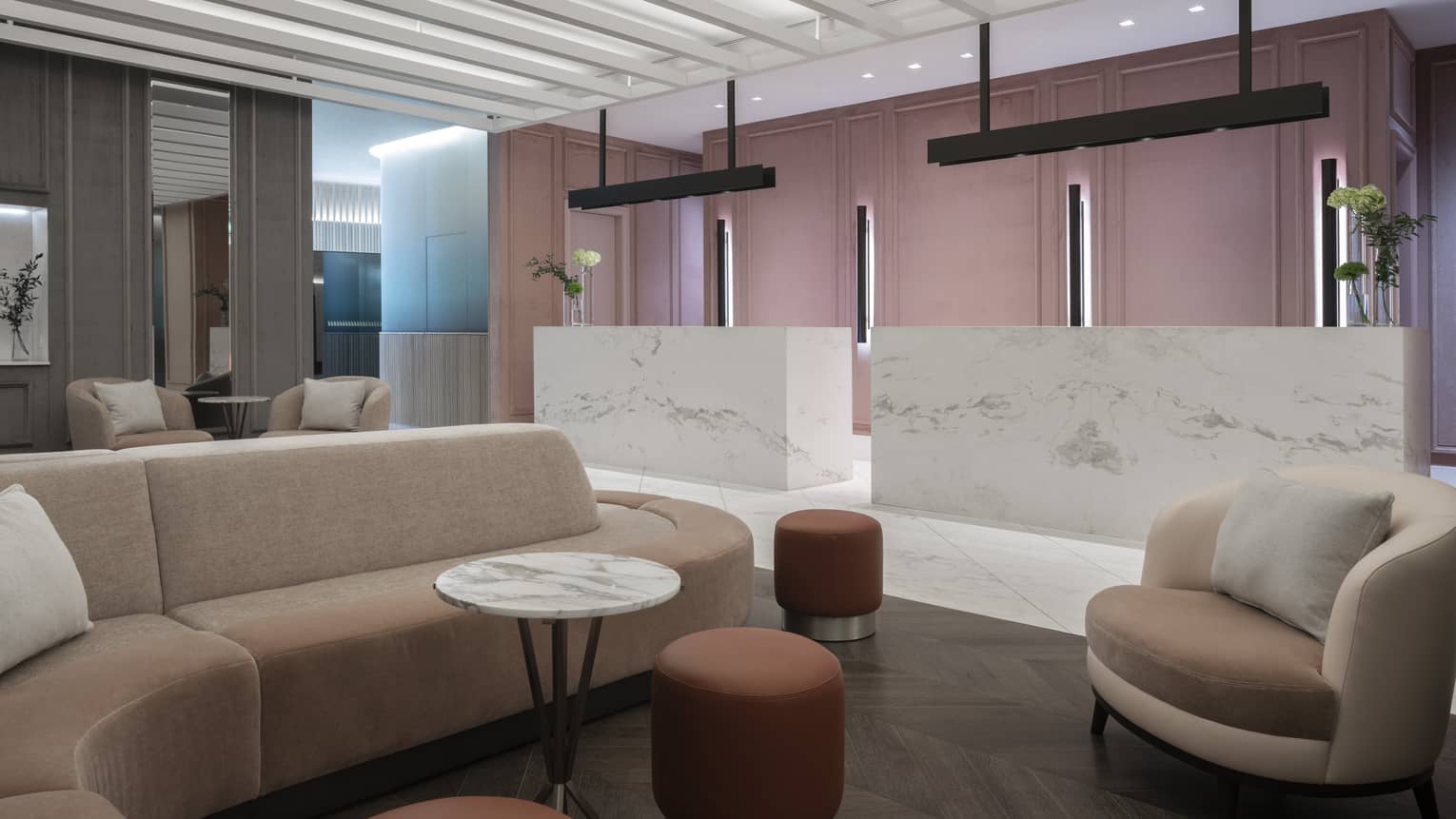 Social area in lobby with marbled desks, modular sofa, chairs, marble table, ottomans 