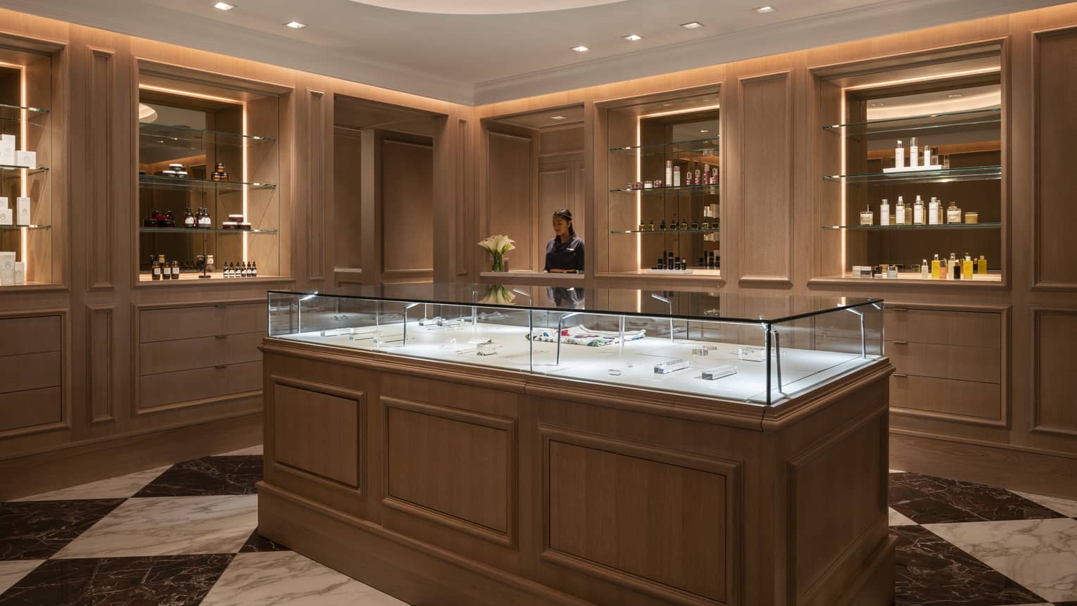 The spa reception area brightly lit by a large circular light. 
