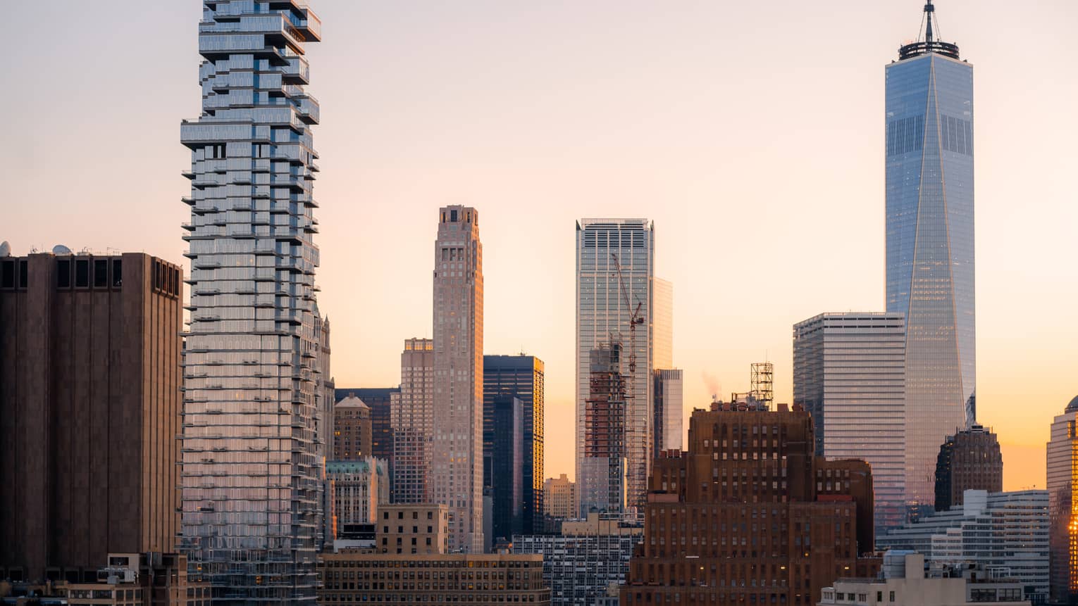 Skyscrapers in front of a sunrise.