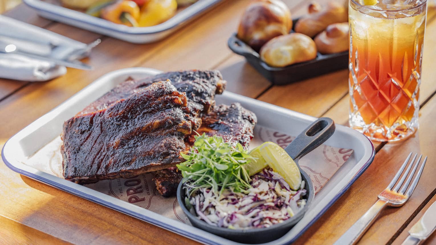 Half rack of glazed baby back ribs with cole slaw and tea