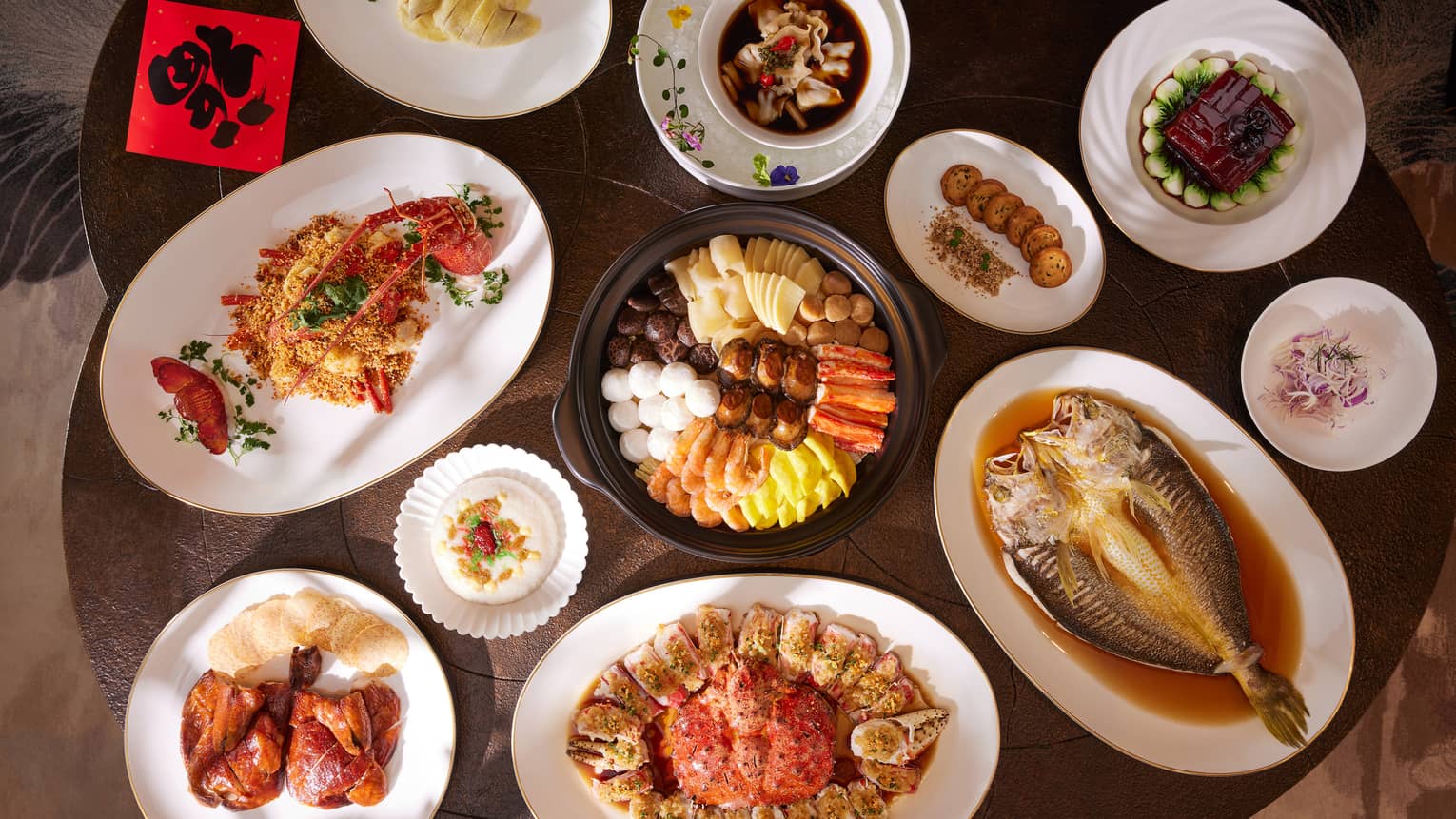 View of table with many Chinese dishes