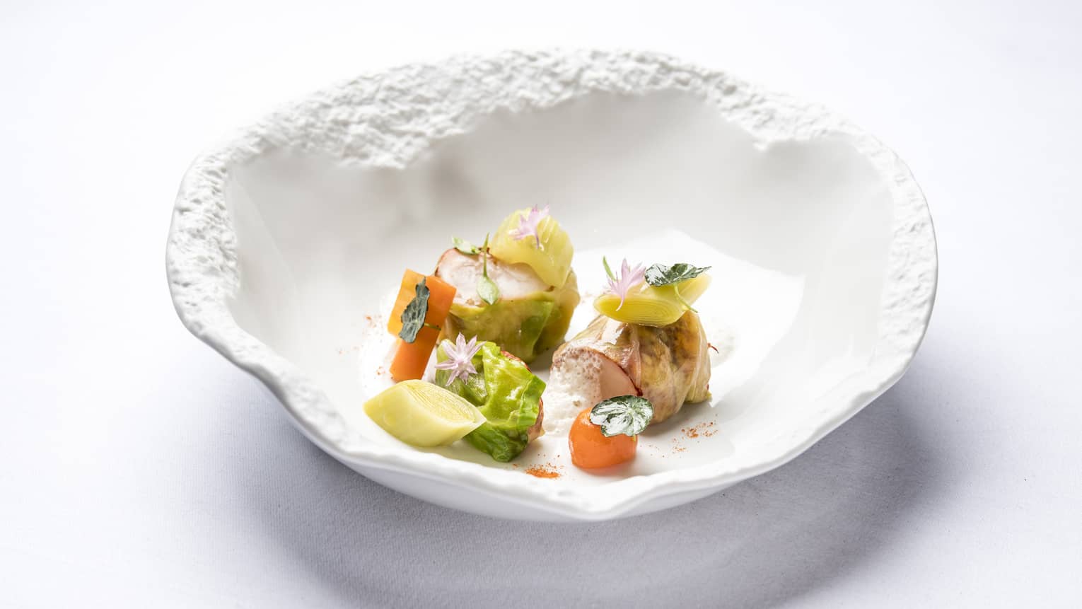 Blue Lobster Nage in artistic white bowl