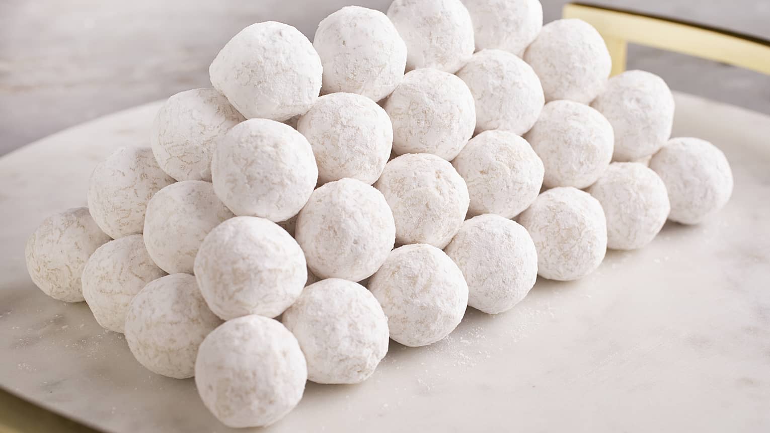White marble platter stacked with White Chocolate Truffles