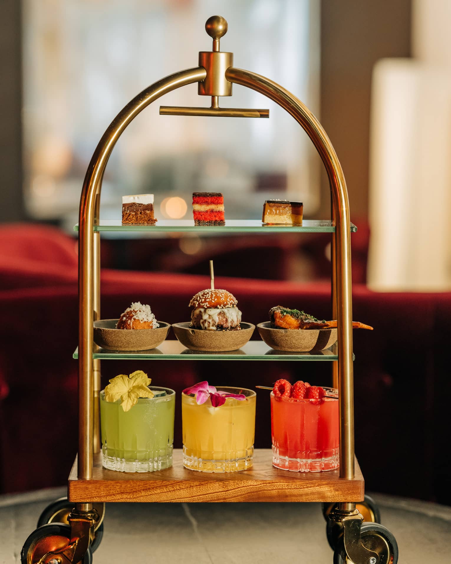 Three-tiered beverage and pastry tray shaped like a miniature luggage cart