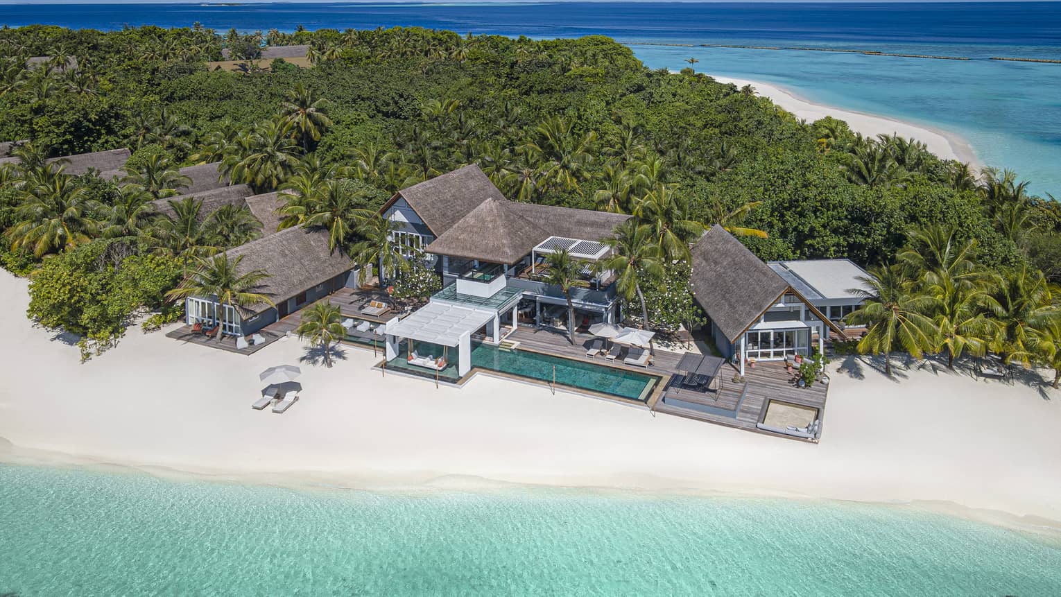 Aerial view of a four-bedroom beachfront estate on tropical island