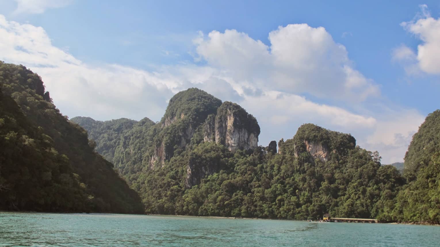 Geopark large mountains towering over water 