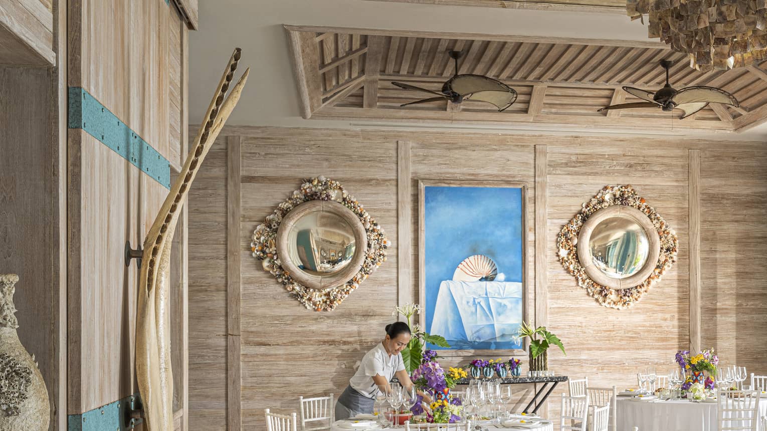 Team member sets up Beach House for event