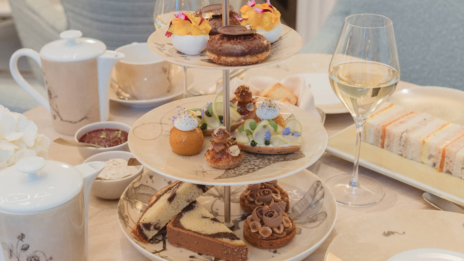Afternoon tea stand filled with assorted treats and bites