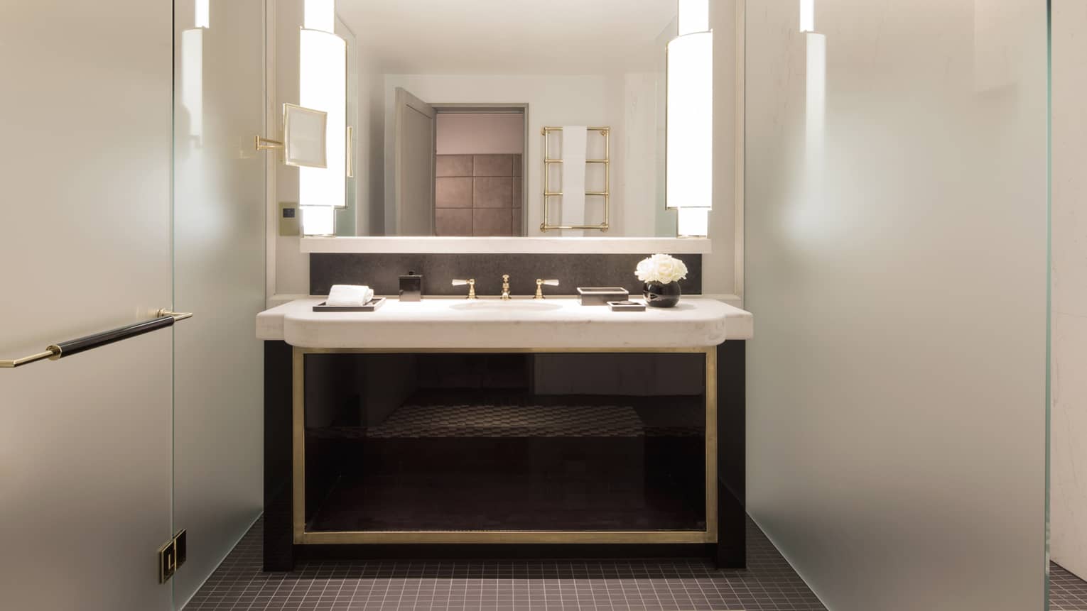 Bathroom with modern vanity and walk-in shower at Four Seasons Hotel London at Ten Trinity Square