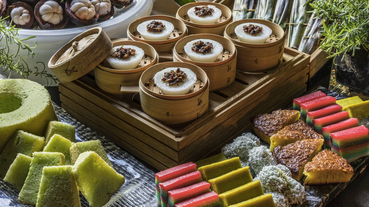 An array of vibrantly colored sponge cakes, lemon bars and other assorted pastries 