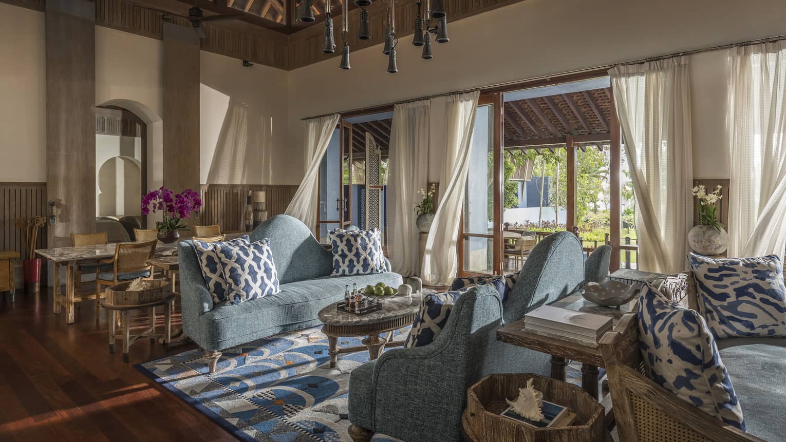 Three Bedroom Villa living room with two soft blue couches and airy views