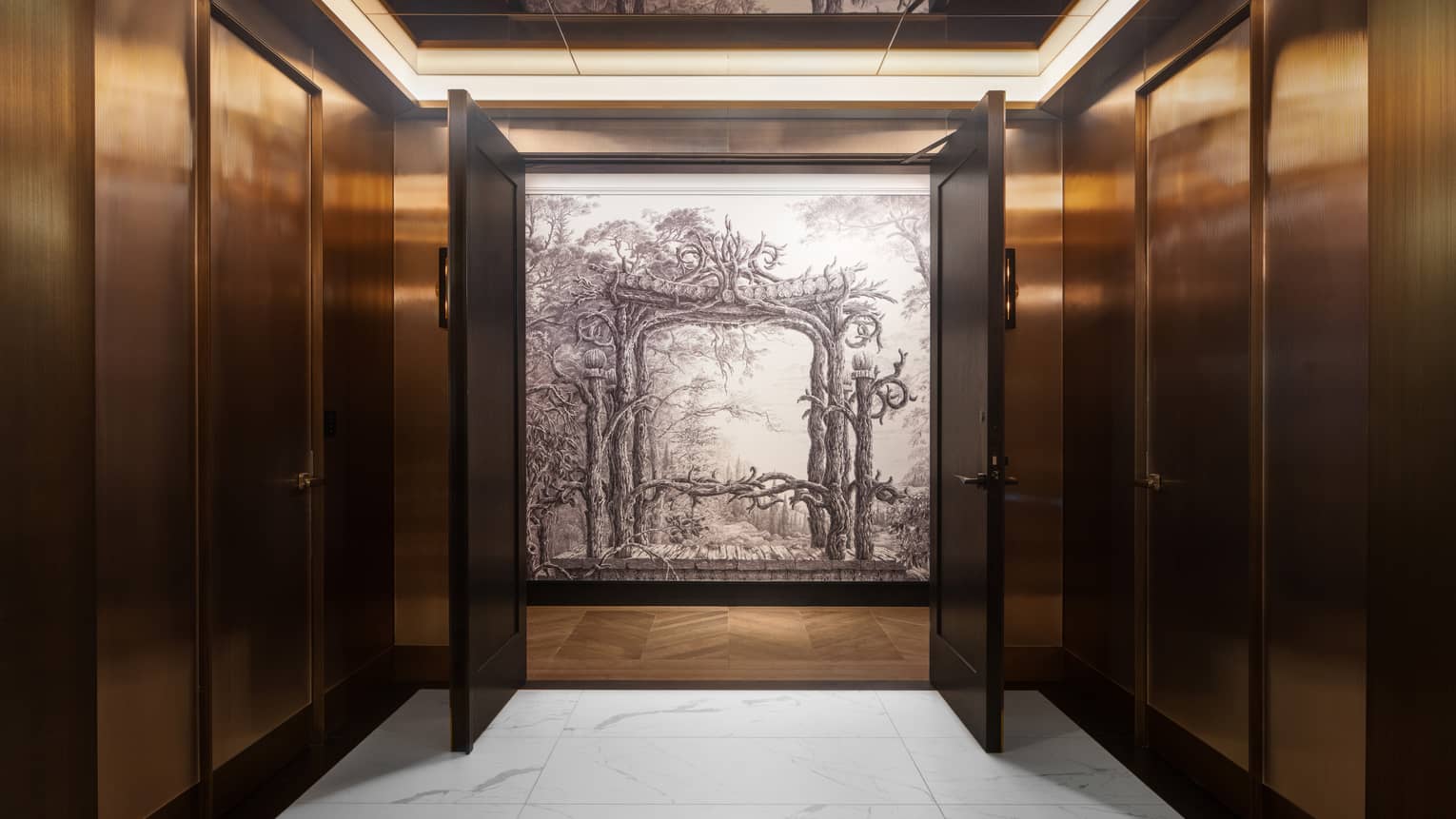 Interior wood-panelled hallway with two doors opening up to reveal a black-and-white painting