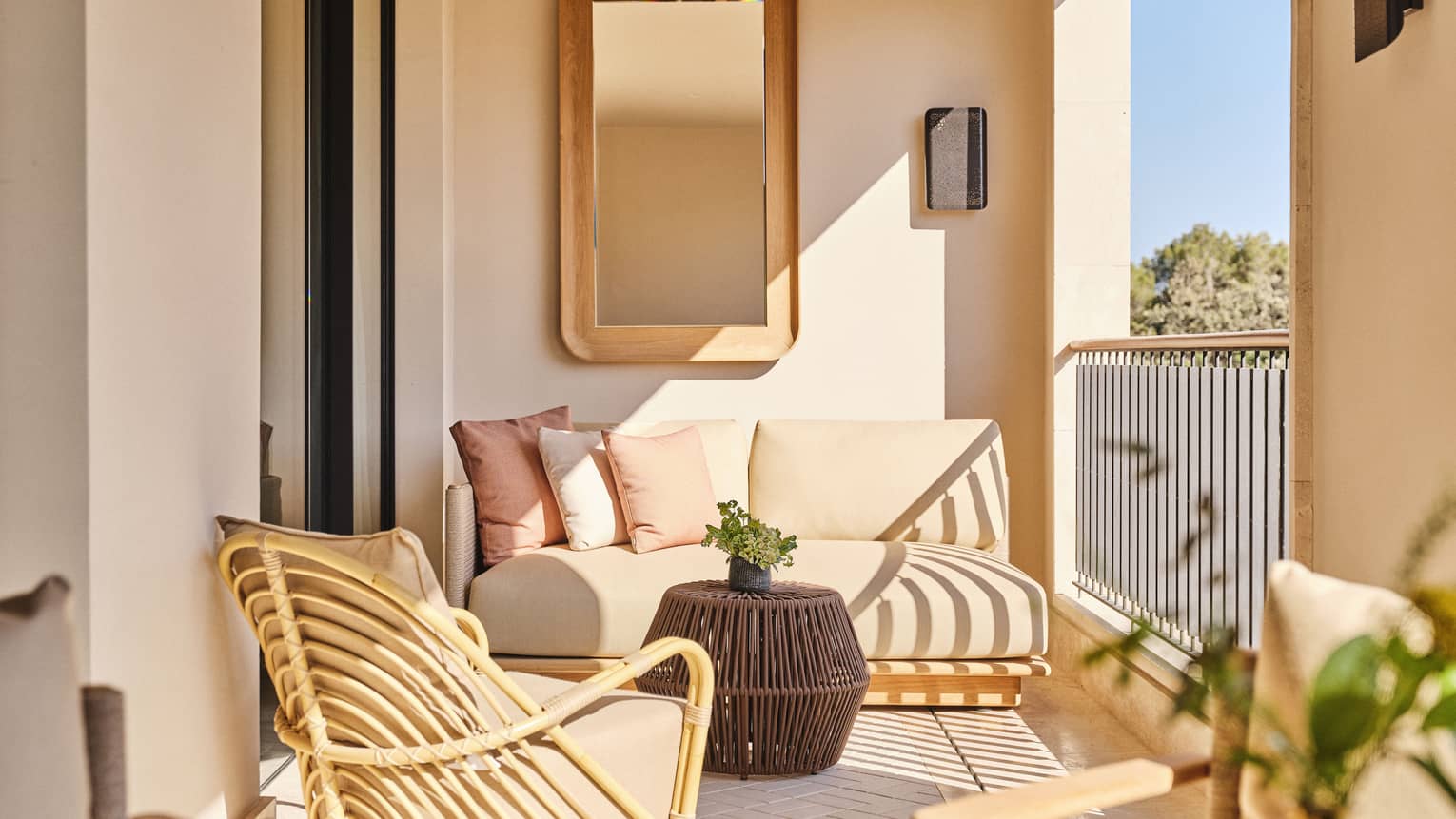 Private balcony with chic, natural furnishings at Four Seasons Resort Mallorca