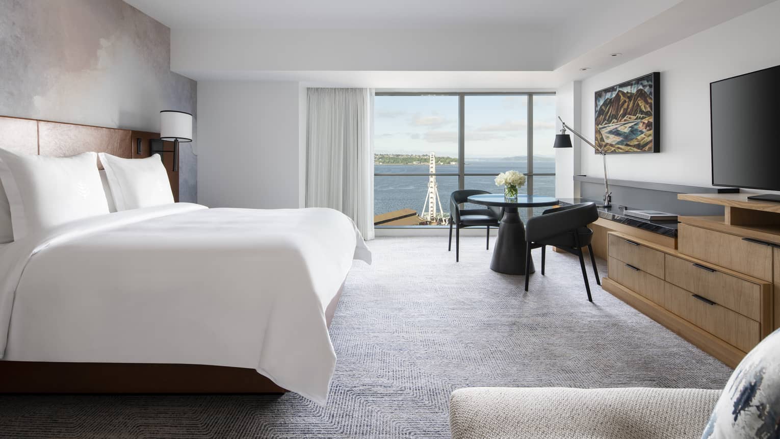 Deluxe Bay-View Rooms offer views of Elliott Bay through floor-to-ceiling windows