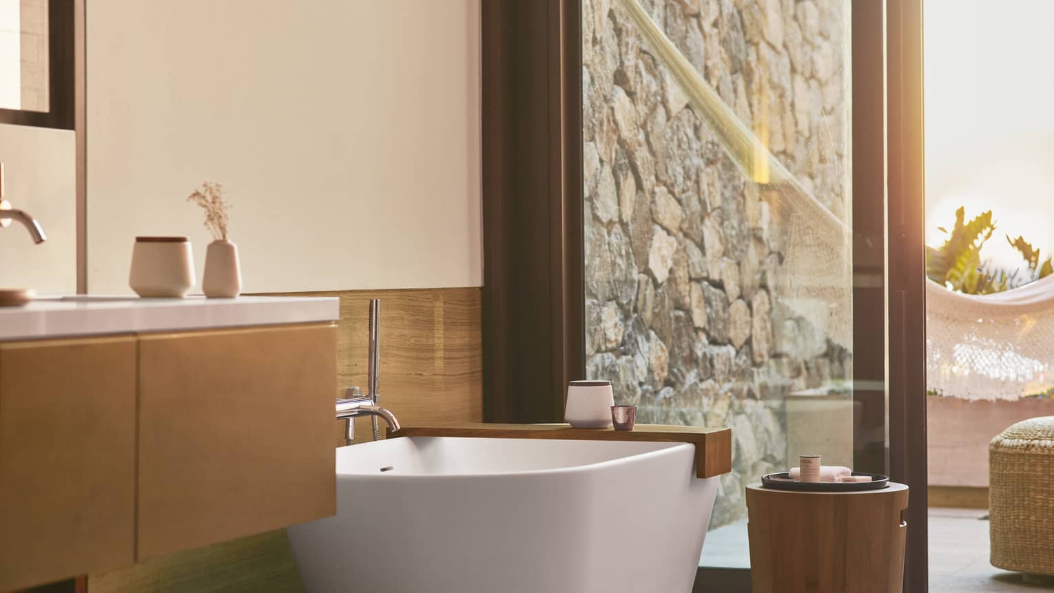 Beachfront Suite bathroom with large soaking tub, sliding glass door leading to terrace