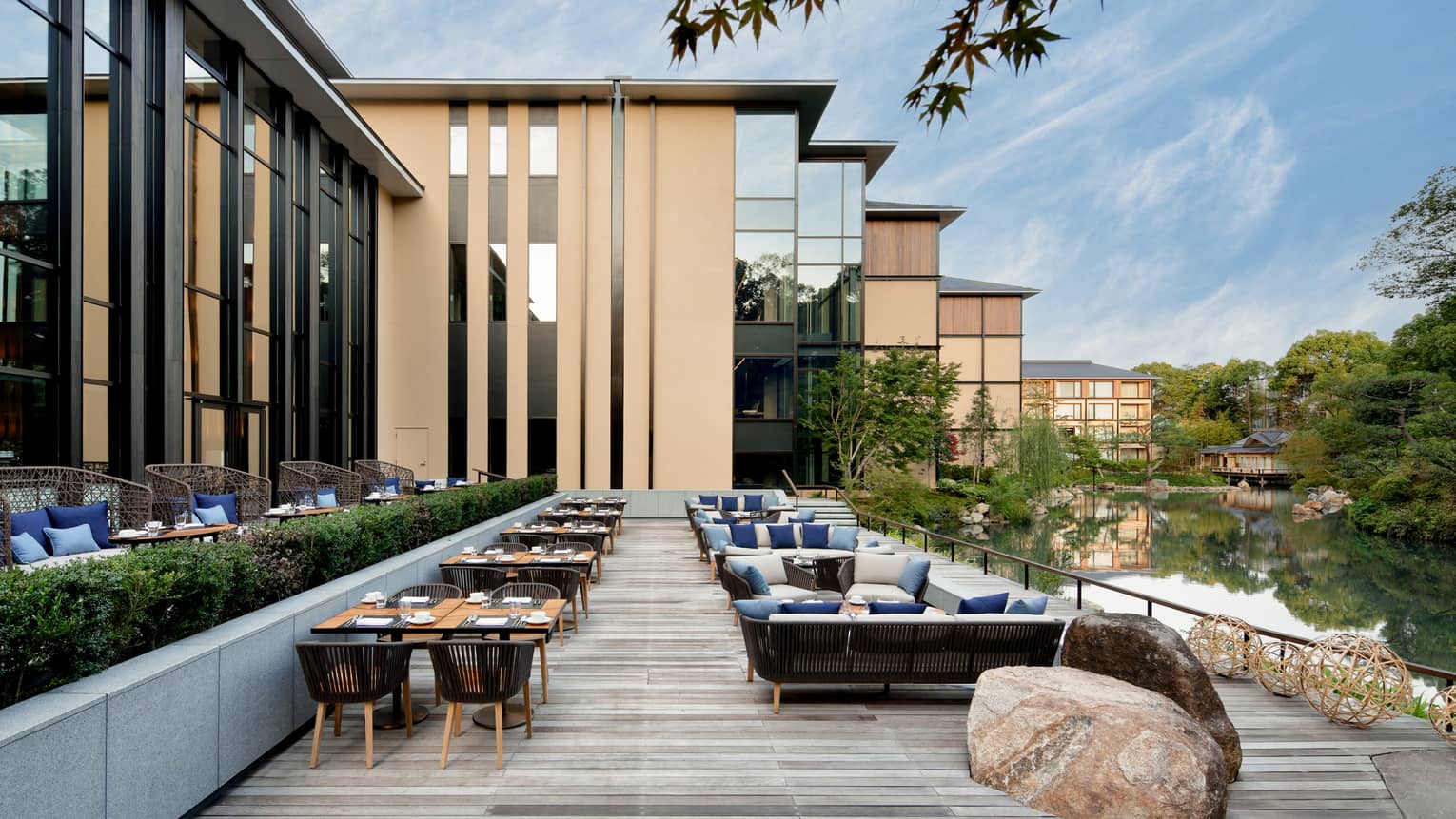 Tables, chairs and large rock on Brasserie Terrace