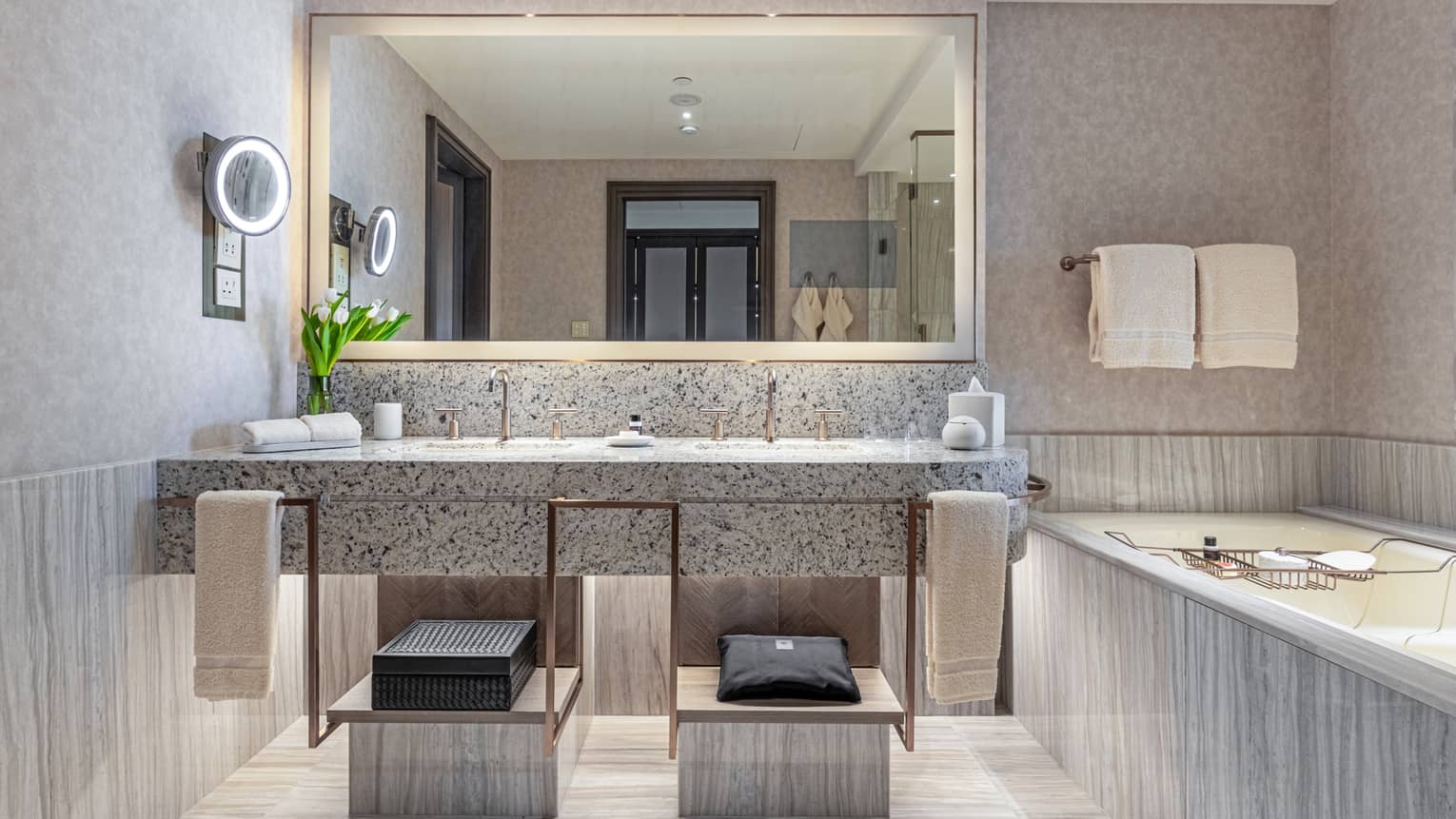 A grey marble bathroom.