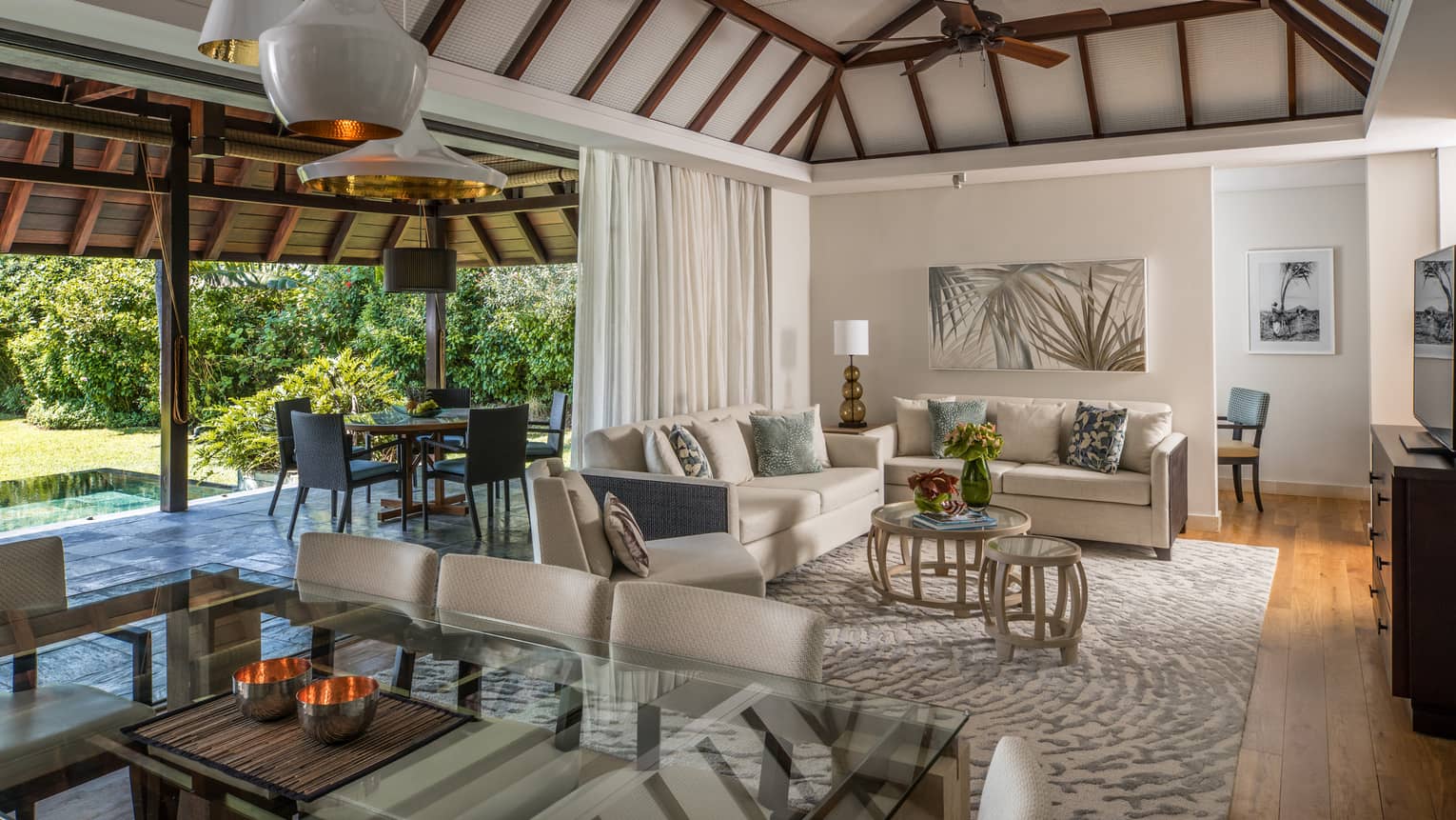 Garden Residence Villa large dining table, modern lights from cathedral ceilings, living room