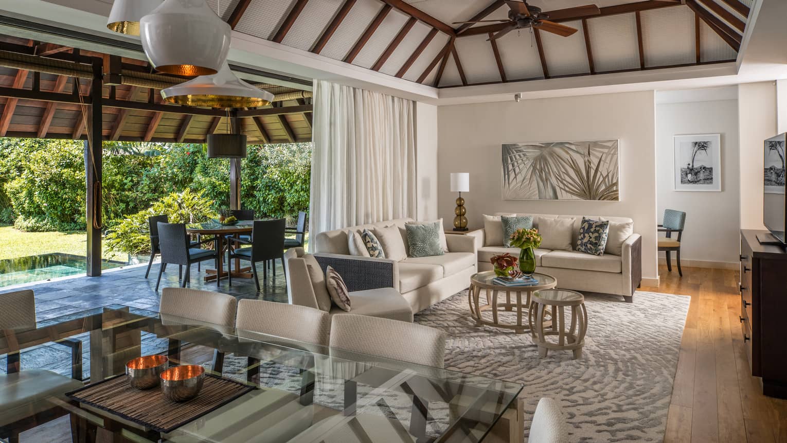 Garden Residence Villa large dining table, modern lights from cathedral ceilings, living room