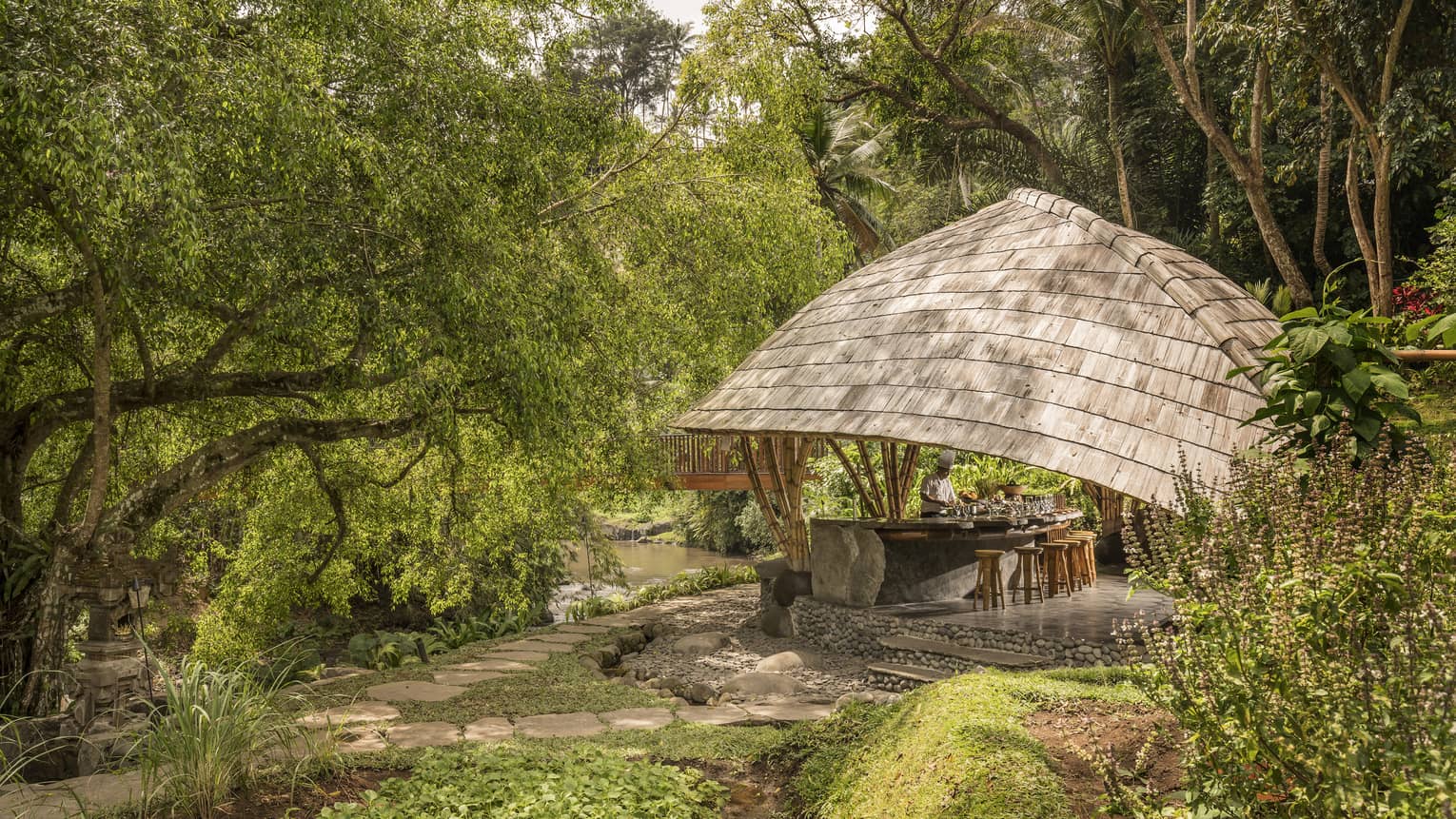 Four Seasons guests attend Sokasi Cooking School in an outdoor pavillion