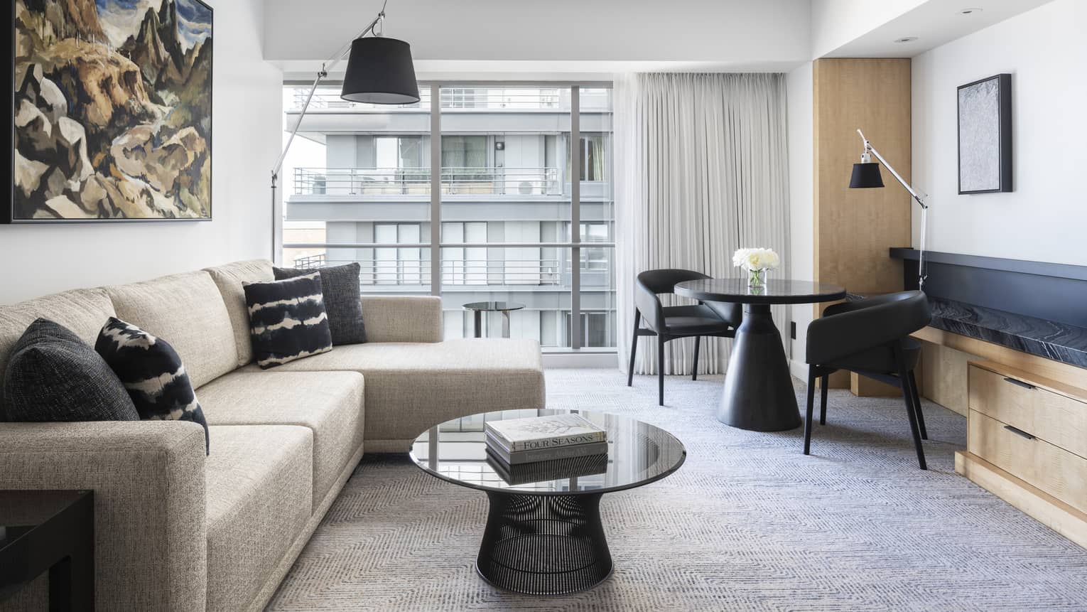 A living room has a comfortable sofa, table and counter space