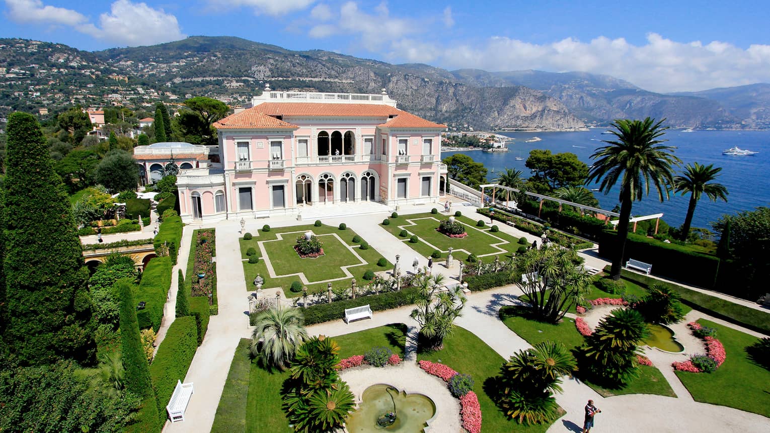 The Grand Hotel, overlooking the water with beautiful arches and pristine gardens 