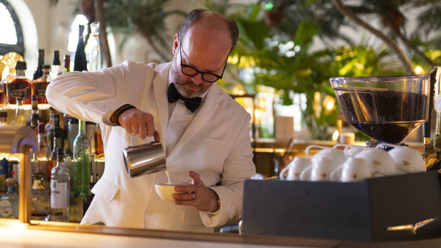 A man making a cappucino.