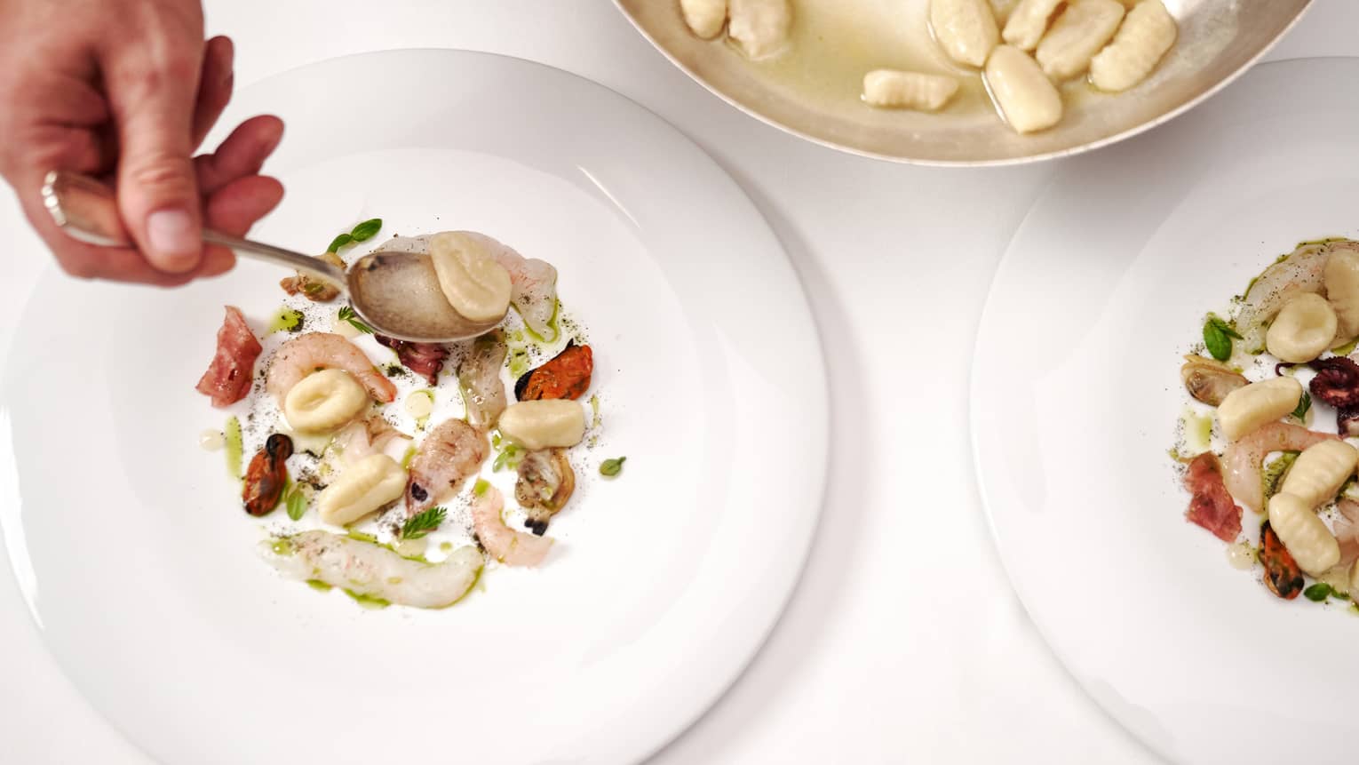 Gnocchi with raw seafood.