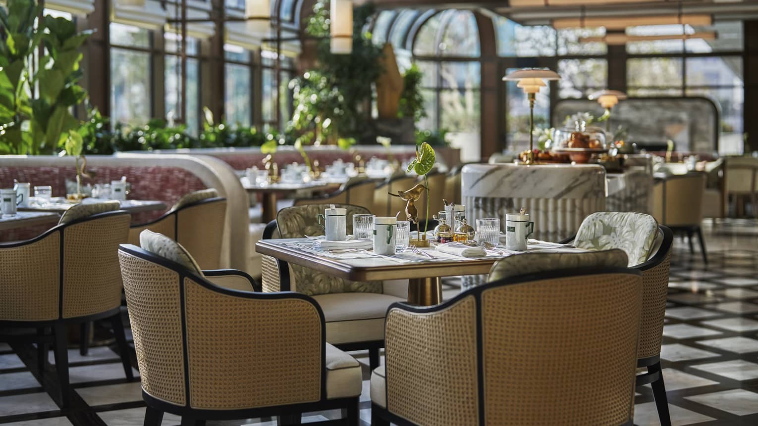 Dining table set in a glass-ceiling dining terrace