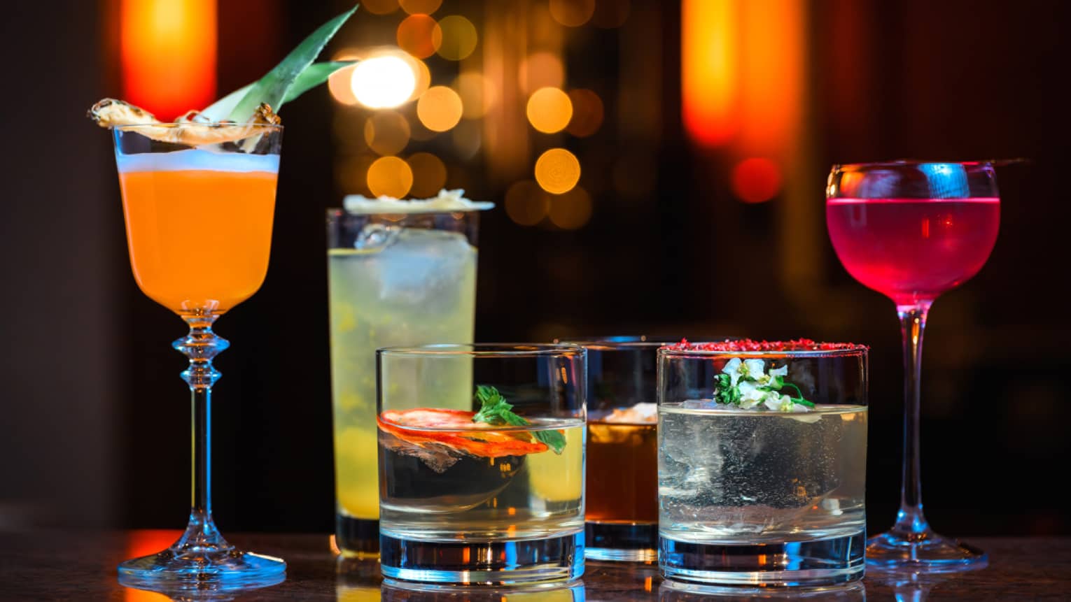 Six assorted cocktails on tabletop