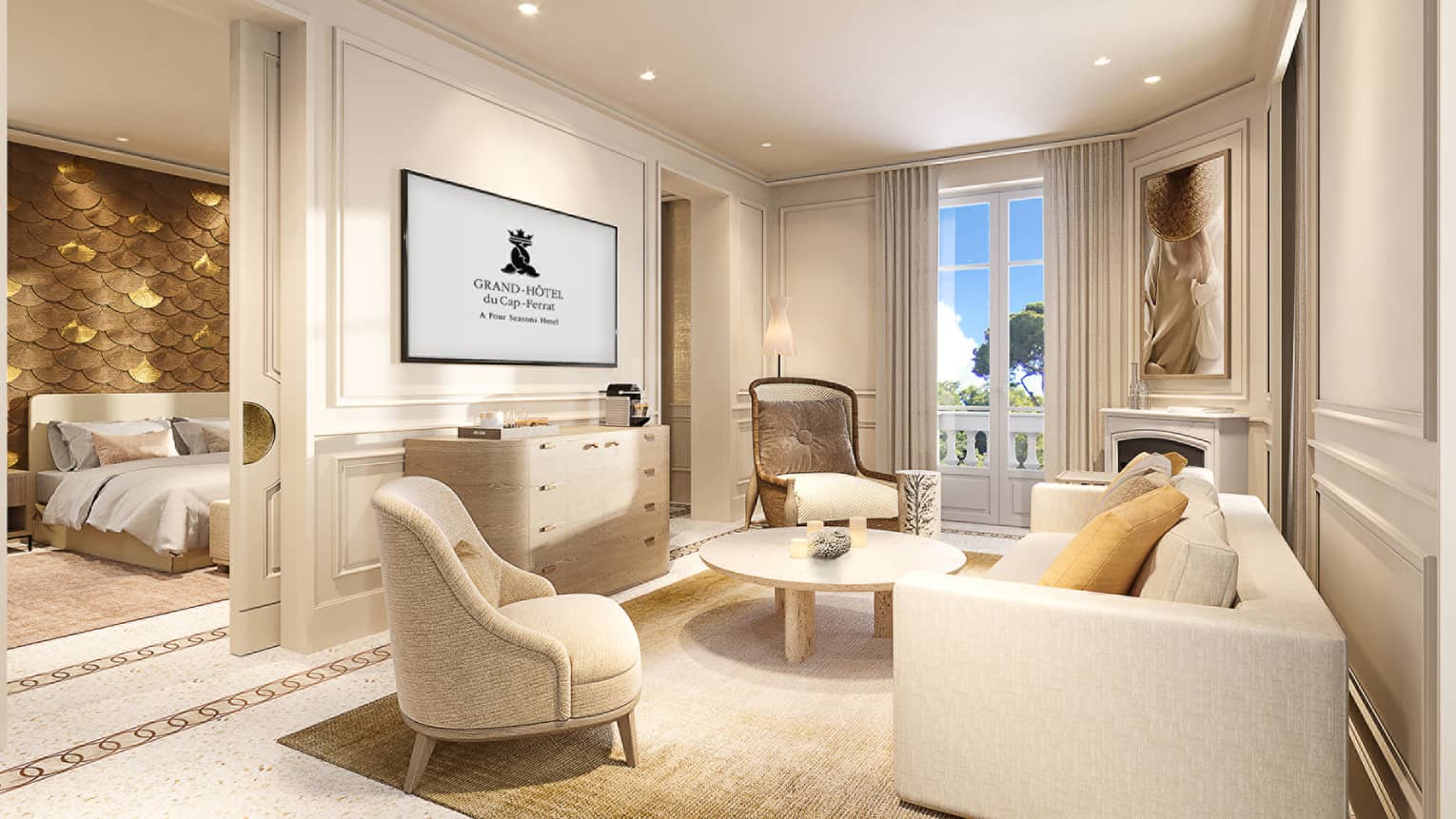 Living room with white sofa and two arm chairs, TV, entrance into bedroom