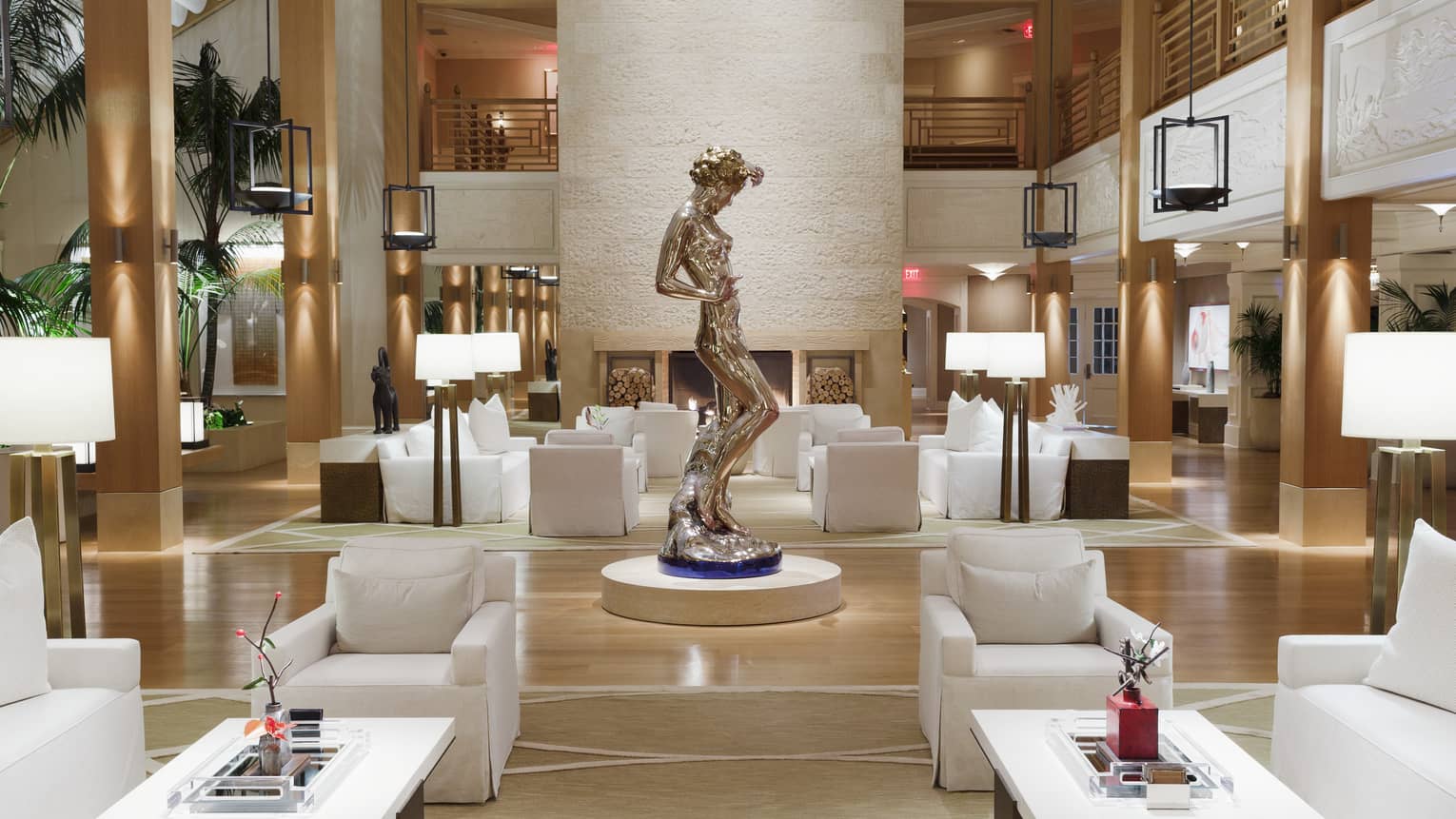 A sculpture of a woman stands in the middle of Sensei Lanai, A Four Seasons Resort lobby
