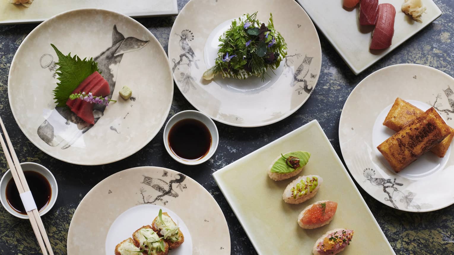 An assortment of food including sushi.