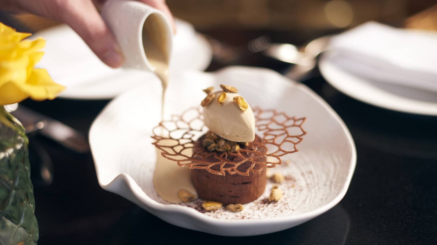 Chocolate mousse with toppings on a white plate