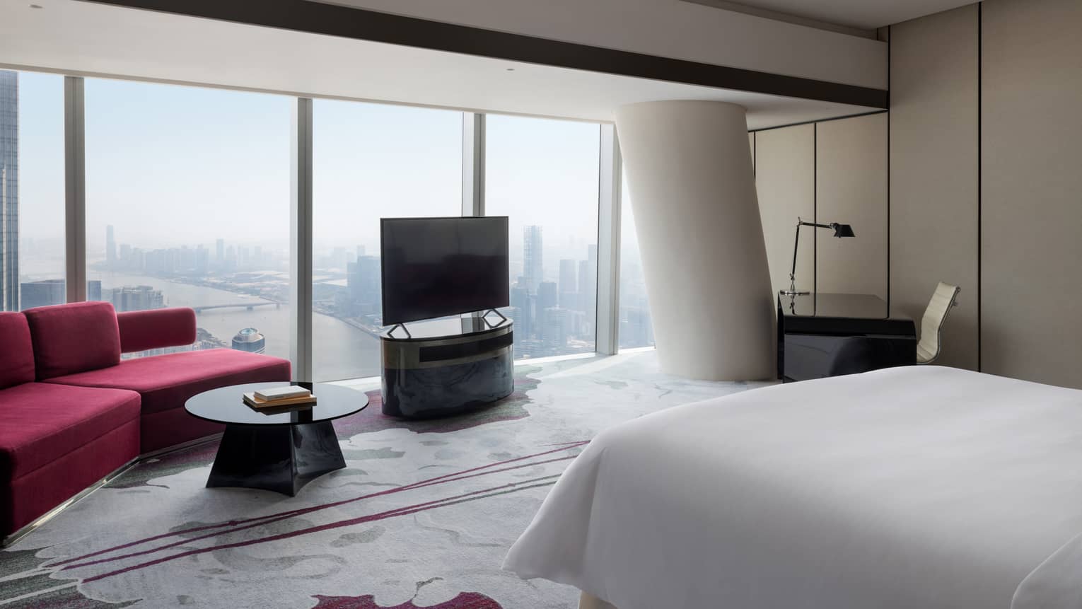 Deluxe King Room River View Room with red accents and floor-to-ceiling windows