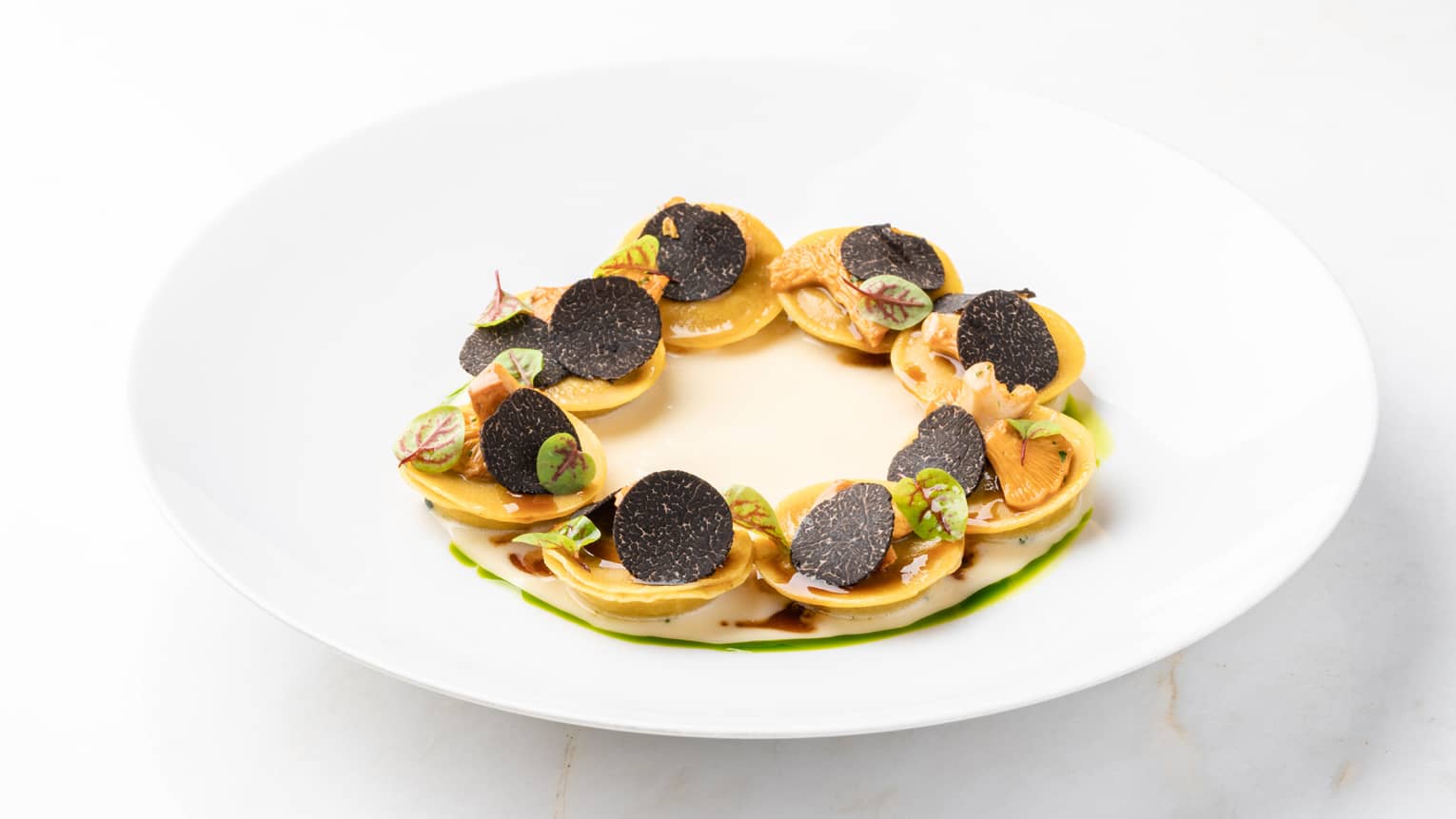 Veal ravioli, seasonal mushrooms, black truffle