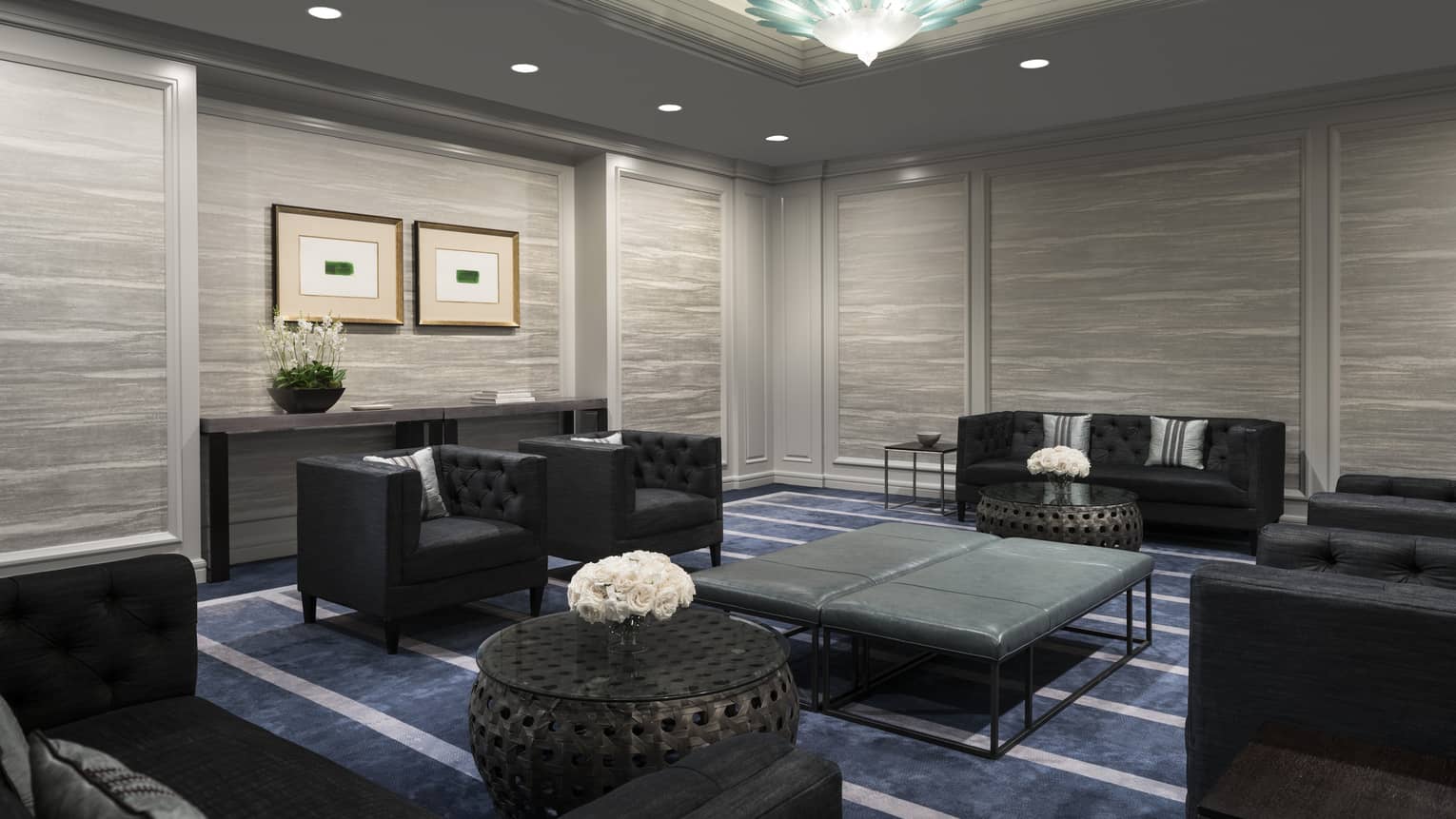 Stinson Room event lounge with black sofas and armchairs, leather bench