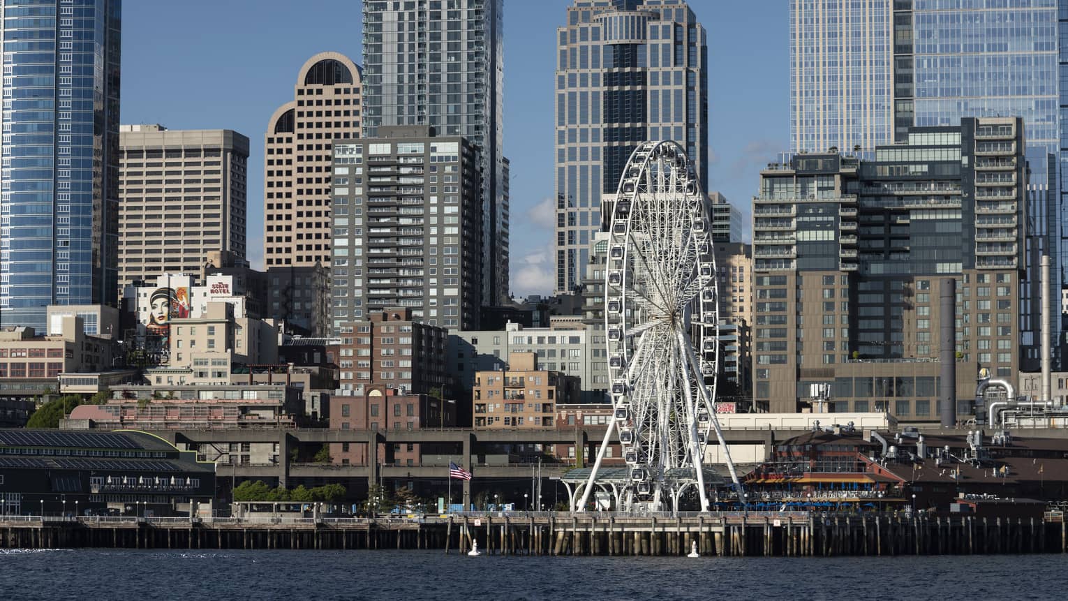 The Seattle Great Wheel stands out among skyscrapers on Elliott Bay