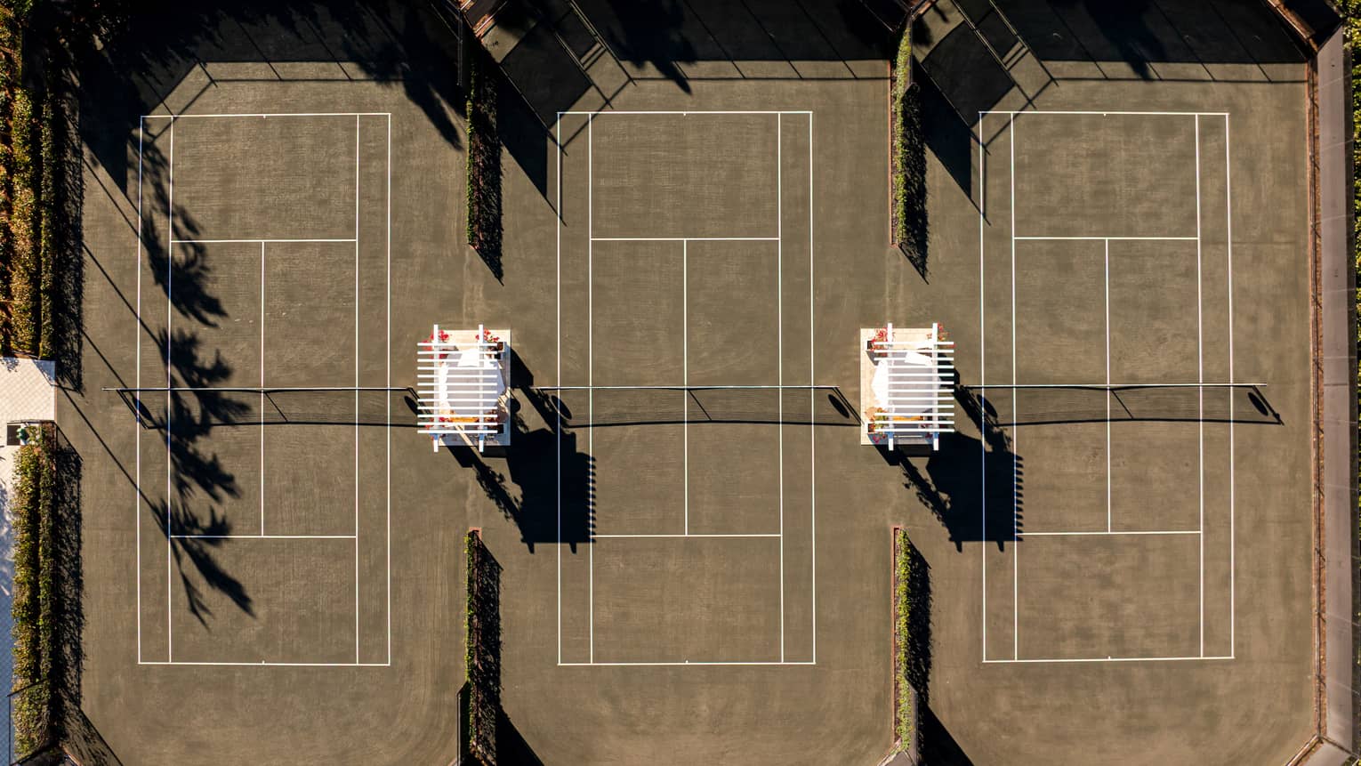 Aerial view of three outdoor tennis courts
